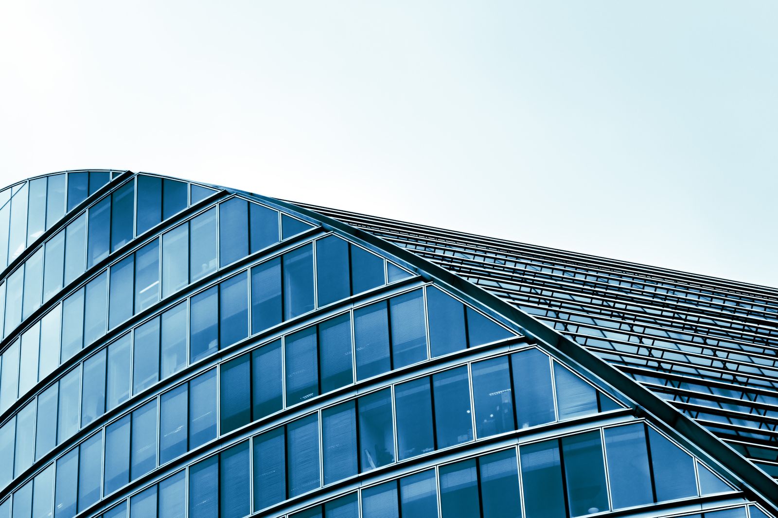 Modern glass and steel commercial building exterior showing clean architectural detail